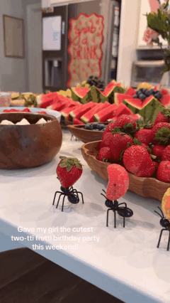 Animated demo of ant-shaped snack and fruit picks on a party table