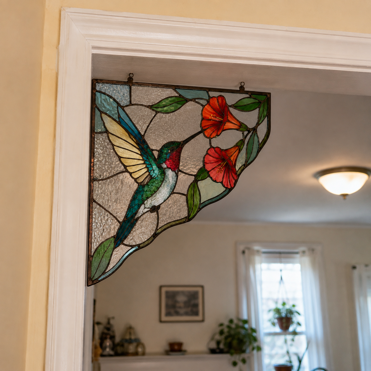 Hummingbird stained glass decoration hanging in the corner of a doorway