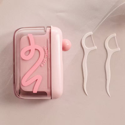 🦷🔄Travel-sized storage case - features an automatic pop-up dispenser