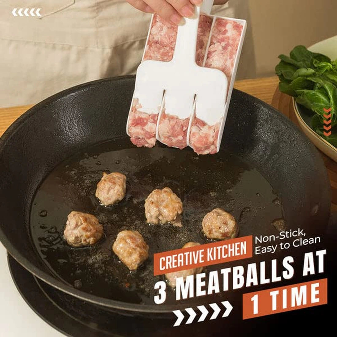 Three meatballs released into frying pan at one time