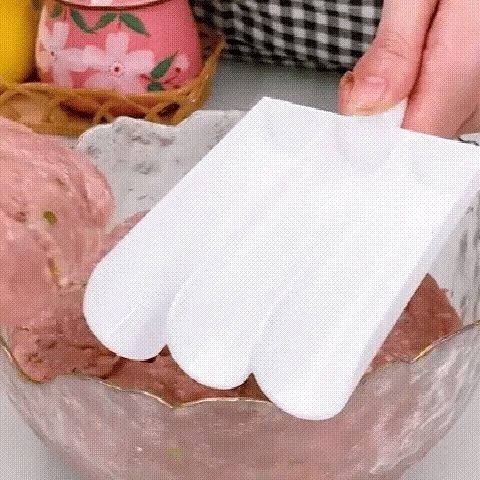 Close-up of triple meatball maker in use