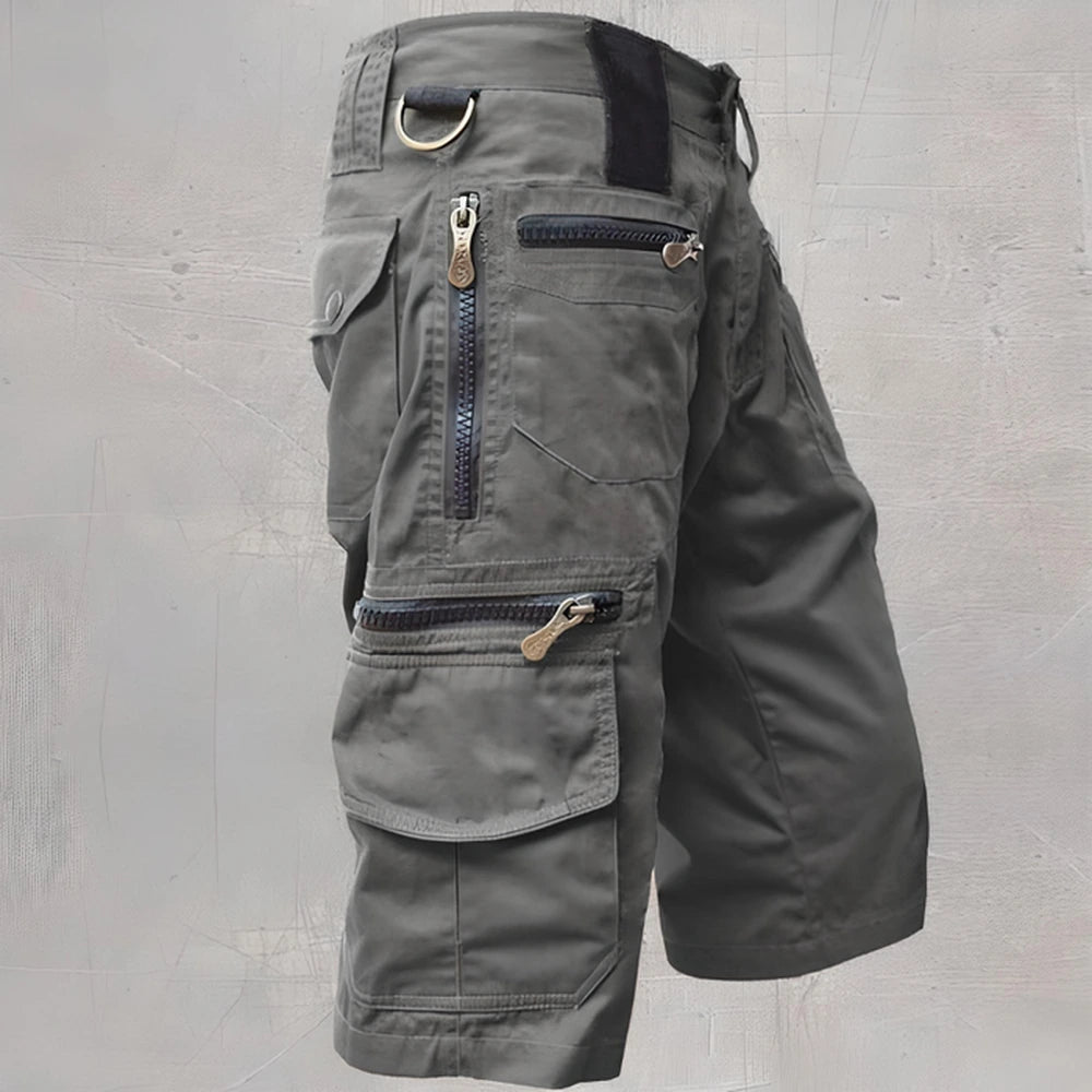 Gray cargo shorts showing multiple zipper pockets