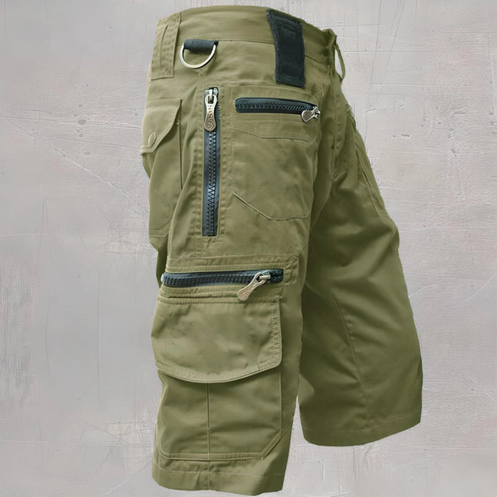 Olive cargo shorts showing utility pocket layout