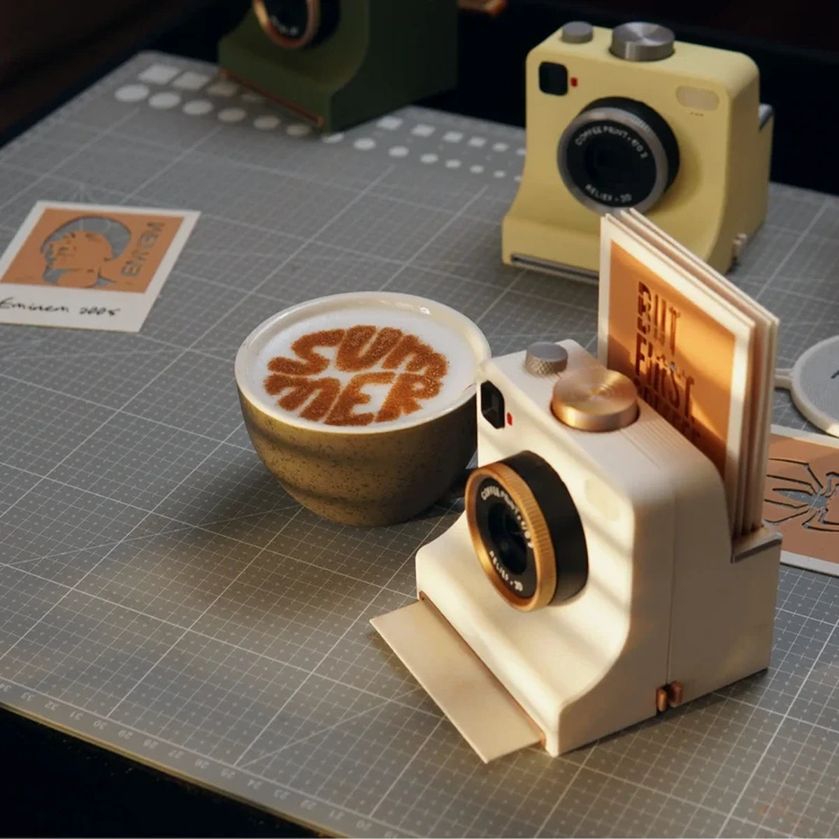 Coffee art camera beside latte on a worktable